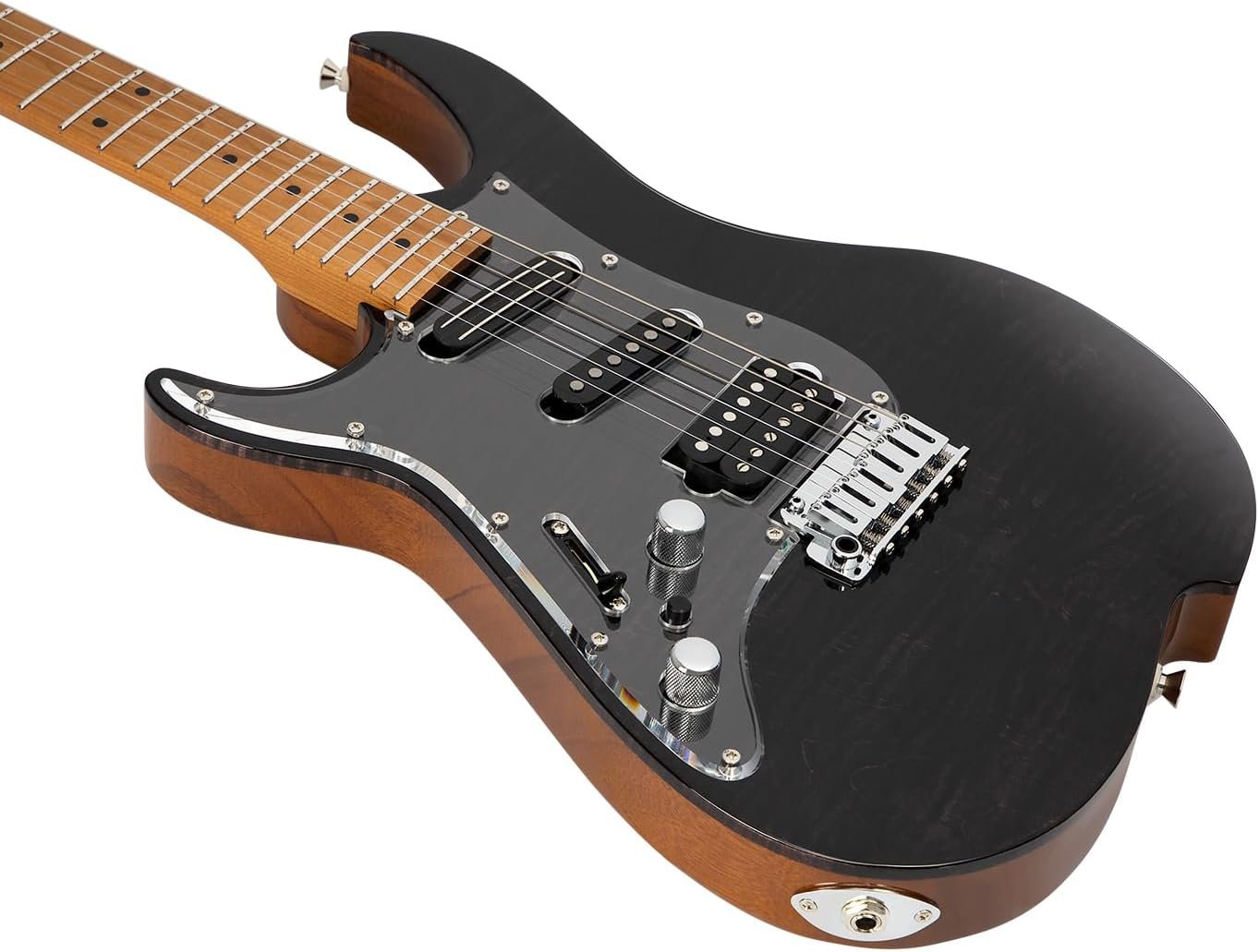 Left-handed electric guitar beside a recording setup at home